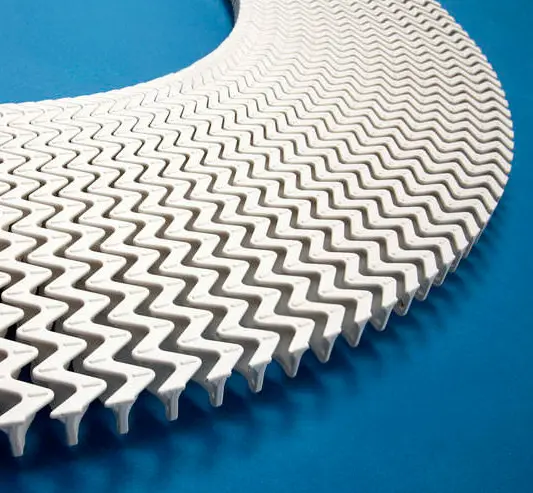 Curved overflow grid in polypropylene
